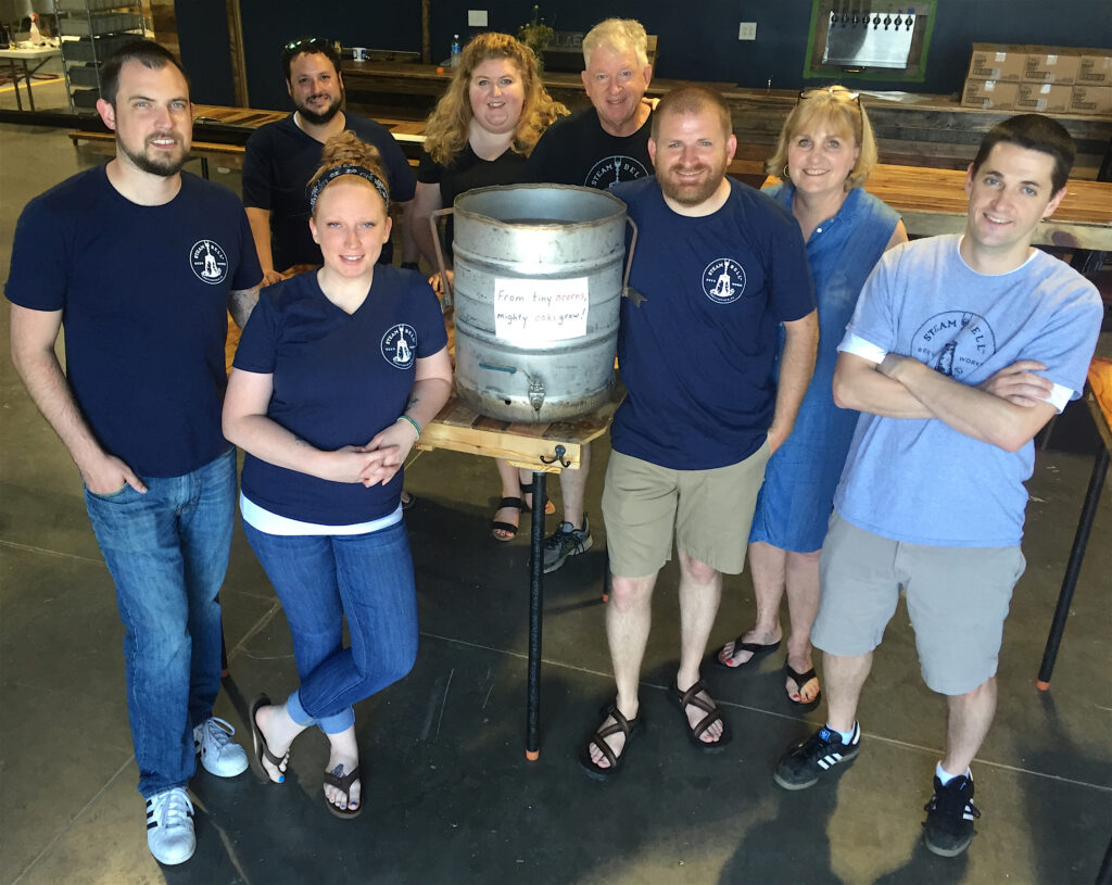 The Steam Bell Beer Works crew consists of (from left) Bryan Hicks, Jacob Morgan, Maggie Pearson, Brittany Cooper, Tom Cooper, Brad Cooper, Connie Cooper and Joey Johnson. Photo by Lee Graves
