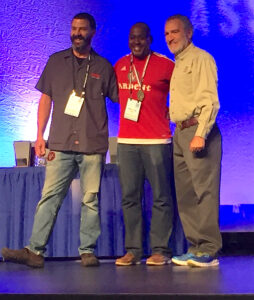 Lincoln Smith (left) and Dominic Finney (center) of Ardent Craft Ales join Charlie Papazian onstage. Photo by Lee Graves